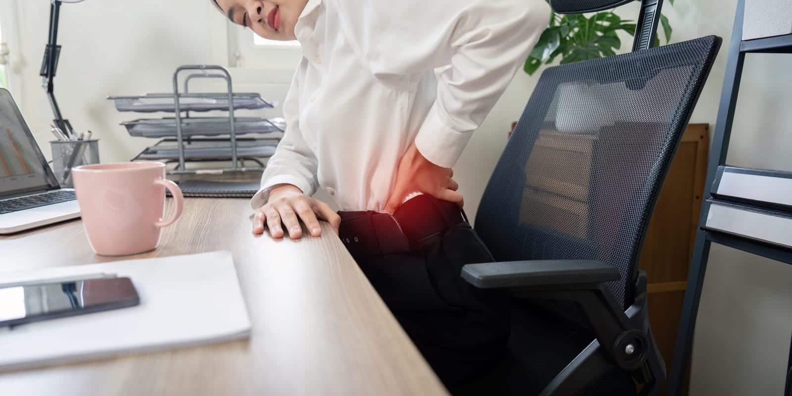 Professional Experiencing Back Pain At Office Desk Workplace Health And Ergonomic