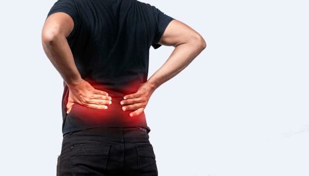 A Sore Man With Back Pain, Man With Spine Problems, Person With Back Problems On Isolated Background, Lumbar Problems Concept